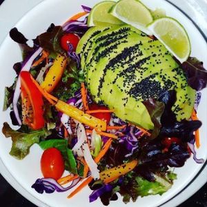 Avocado salad with cherry tomatoes, yellow pepper, red cabbage and mix veggies, filled with chia seeds at Bamboo Bar & Vegetarian Restaurant in Sihanoukville