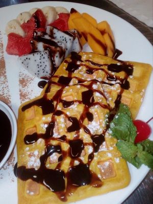 Belgium waffles with fruits and chocolate at Bamboo Bar & Vegetarian Restaurant in Sihanoukville