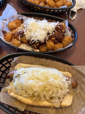 Artisan dog and tater tots that have chili and cheesee  at Happy Dog - Detroit Ave in Cleveland