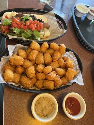Chili topped dog with plain tots and dipping sauces   at Happy Dog - Detroit Ave in Cleveland