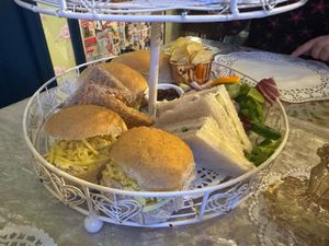 A variety of sandwiches (cheese and pickle, hummus, cucumber), with crisps and salad at The Rabbit Hole in Stoke-on-trent