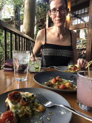 Enjoying our vegan cashew cheese toast before being asked to move so they could give our table to someone else.  at Pedalers Fork in Calabasas