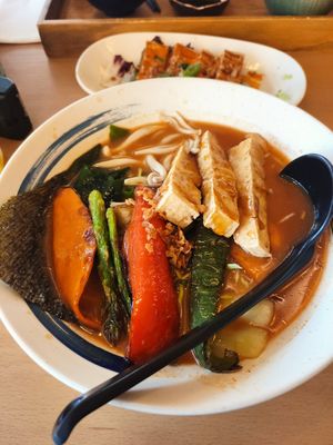Spicy tofu miso ramen. In the background spicy fried tofu. at SUKI RAMEN  in Valencia