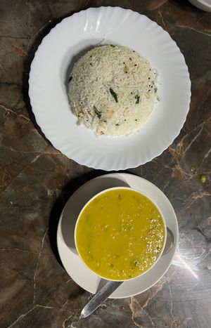 Dal and coconut rice with cashews and curry leaf. at Banana Leaf Restaurant Kovalam in Kovalam