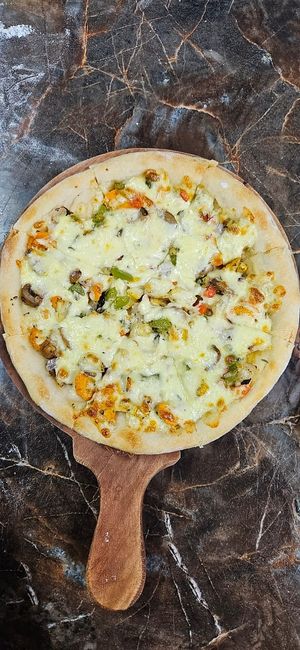 Home-made pizza. Cooked to order and we even make the base. at Banana Leaf Restaurant Kovalam in Kovalam