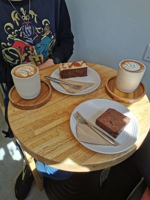 Toffee biscoff slice and 2 chai lattes with oatmilk. Brownie was not vegan. at Simba Bru Coffee Roasters in Watford