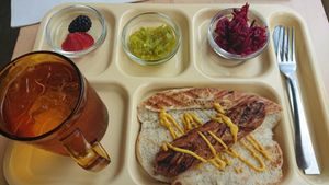 Meal served on tray, my drink was water.  Coffee w/ plant milks available.  Beet kraut, chow chow mix and some mustard. The bread is perfect. at Rigby Roastery @ Boycott Coffee - Pop Up in Memphis