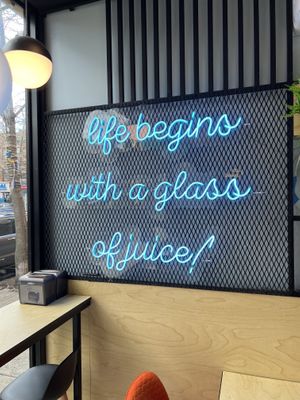   Neon sign: life begins with a glass of juicee  at Juice Time in Brooklyn