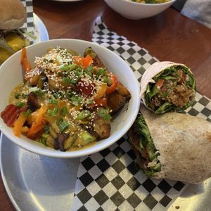Ultimate club wrap, sub crispy chick-un, with a side of dragon fries  at Wild Leek in Halifax