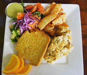 Classic Plate at Wild Leek...Tofu scramble, seasoned potatoes, cornbread, salad, and fruit. Yum! Breakfast is served everyday until 4pm and comes with a free cup of coffee.
 at Wild Leek in Halifax
