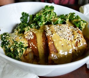 Breakfast Bowl at Wild Leek...Seitan bacon, roasted potatoes, sautéed mushrooms & onions, kale, toasted sesame seeds, and dragon sauce. Yum! Breakfast is served everyday until 4pm and comes with a free cup of coffee.
 at Wild Leek in Halifax
