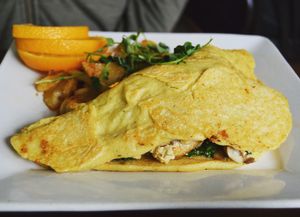 Vegan 'nom-let' at Wild Leek...Omelette filled with kale, mushrooms, and tofu scramble. Served with seasoned potatoes. Breakfast is served everyday until 4pm and comes with a free cup of coffee. at Wild Leek in Halifax