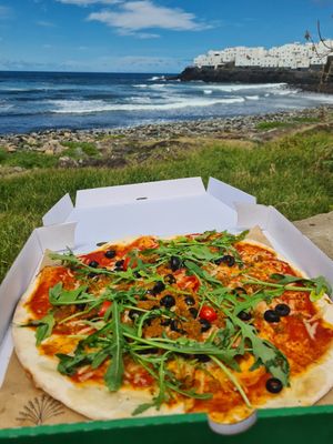 Take away vegan pizza enjoyed few hundred meters away from the restaurant at Nativo Las Palmas in Gran Canaria