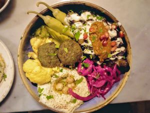 (VE) Bowl of jeweled tabbouleh, green pean falafel, hummus, pickled veggies including pickled green pepper (mild). My favourite main from the Geek menu. Good portion, and yummy. at The Picturedrome in Macclesfield