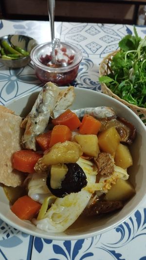 Mi Quang (I added extra money for the spring rolls). at Quán Chay Diệu Hoa in Hoi An