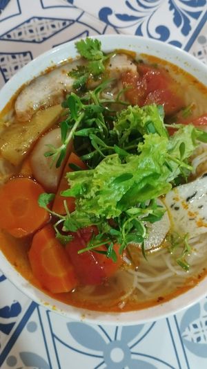 Sometimes, the Mi Quang looks different. 
 She ran out of the Banh Da (the crispy crackers) that day. at Quán Chay Diệu Hoa in Hoi An