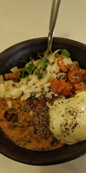 Indian dhal bowl with dhal, brown rice, sweet potatoes, coconut flakes, salad at Glo - Laugavegur in Reykjavik