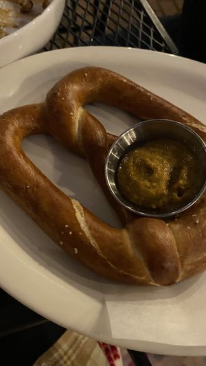 Pretzel with sweet mustard sauce   at The Porch in Santa Margarita