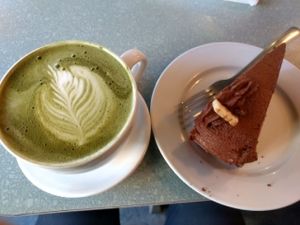 Matcha Latte and vegan chocolate cake at Humani-T Cafe - Downtown in Halifax