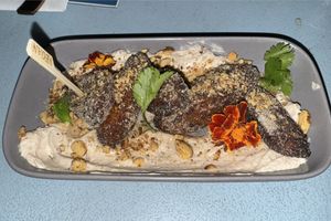 Maduros (ripe plantains) with vegan crema   at Linger in Denver