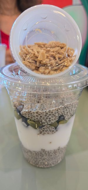 Vegan Chia and Coconut Yogurt parfait with blueberries, pumpkin seeds, and granola at Nourish Wellness Cafe - Pop Life  in Cleveland