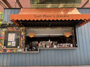 Super cute food stall with plenty of seating   at Soul Miner's Garden  in Charlotte