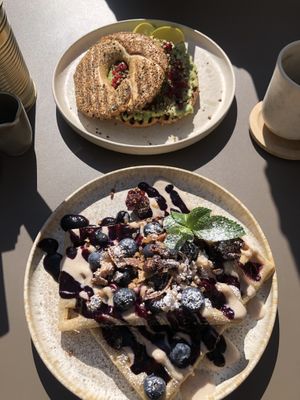 Avocado bagel and berry waffles 🧇   at LUUC Café in Mannheim