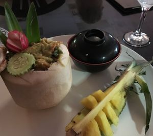 Green curry in a coconut with fresh pineapple to cool the heat of the spice ... awesome! at Thai Spice in Corpus Christi