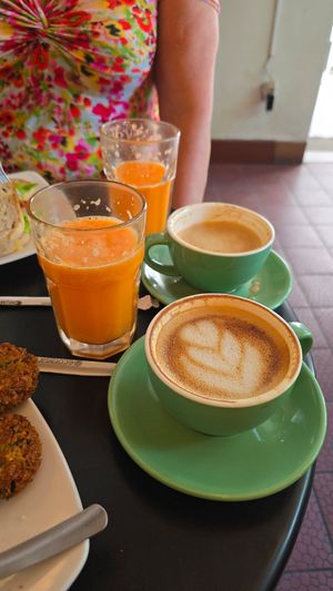 Vitamin C Booster juice and coffee with oatmilk at Mom's Bakery in Bandung