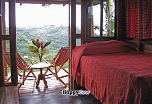 Guest room with beautiful vistas from the balcony at Farm of Life - Finca de Vida in Dominical