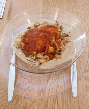 Kita Phetfet", an excellent dish resemble to a hot Shakshouka with tehina and small pieces of Ethiopian bread in bite size. at Tenat in Tel Aviv