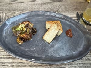 Grilled tofu, Brussels sprouts, smoked date saucee  at 3rd Cousin in San Francisco
