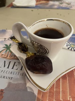 Arabian coffee with a date on the side  at  Palmera Restaurant in Winterthur