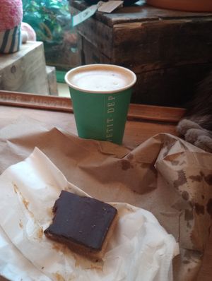 Cappuccino with oat milk, vegan twix pastry at Le Petit Dep  in Montreal