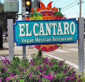 Sign at street at El Cantaro Vegan Mexican Restaurant in Monterey