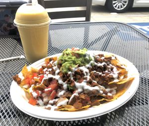 Nachos with steak and mango smoothie at El Cantaro Vegan Mexican Restaurant in Monterey
