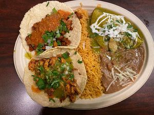 Chicken and steak taco with a spinach enchilada 😋 at El Cantaro Vegan Mexican Restaurant in Monterey