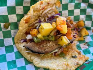 Half eaten fish taco at El Cantaro Vegan Mexican Restaurant in Monterey