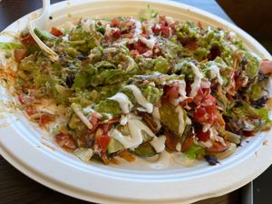 Half eaten Veggie Supreme burrito at El Cantaro Vegan Mexican Restaurant in Monterey