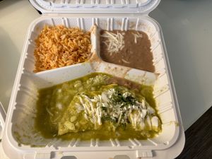 Spinach enchilada with my choice of green sauce, and pinto beans over black beans.   at El Cantaro Vegan Mexican Restaurant in Monterey
