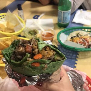 Veggie tofu burrito, veggie taco and chips with salsa and guacamole  at El Cantaro Vegan Mexican Restaurant in Monterey