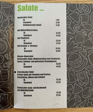 You can order the griechischer salat without cheese but note that there is still sauce on it so also ask to leave the sauce. I'm not sure if they have a vegan option for sauces.   at Novum in Neukirchen Am Grossvenediger