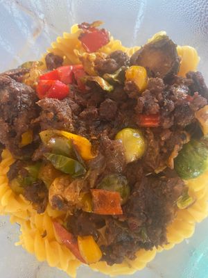 Pumkin seed chorizo, Brussels sprouts, fried onion, red, yellow, orange peppers 
On chickpea pasta 

 at Suka Kitchen Culebra  in Culebra