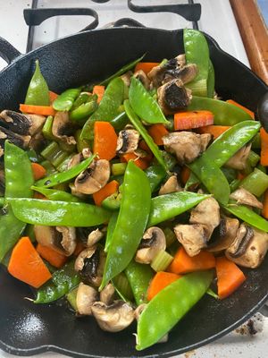 Chickpea tofu Asian stir fry 
Snap peas, edamame, carrots, celery, mushroom, jalapeño, cashews, black sesame, coconut aminos  Kimchi & avocado at Suka Kitchen Culebra  in Culebra