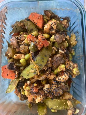 Chickpea tofu Asian stir fry 
Snap peas, edamame, carrots, celery, mushroom, jalapeño, cashews, black sesame, garlic, ginger, coconut aminos  
Kimchi & avocado  at Suka Kitchen Culebra  in Culebra