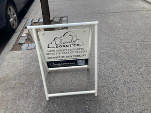 Sign in front (says "Vegan options available") at Cloudy Donut Co - NoLita in New York City