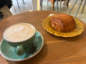 Chocolatine végane et un cappuccino au lait de coco. at Les Belles Âmes Pâtisserie in Lyon