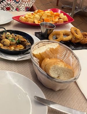 Patatas Bravas, Onion Rings, Bread  at Tapas 75 in Fuerteventura