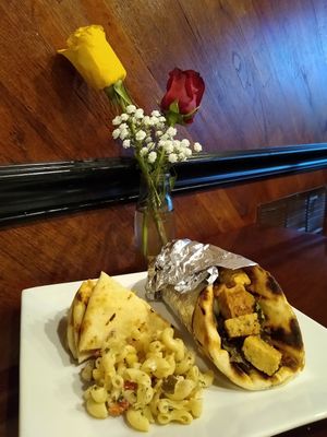 Vegan tempeh Gyro, fresh hummus, pita bread, and macaroni and cheese. at Sunflower Cafe in Fairhope