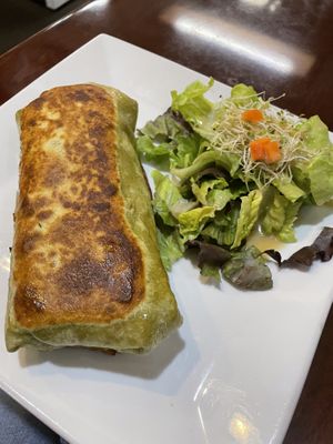 Chipotle black bean burrito with side salad  at Sunflower Cafe in Fairhope